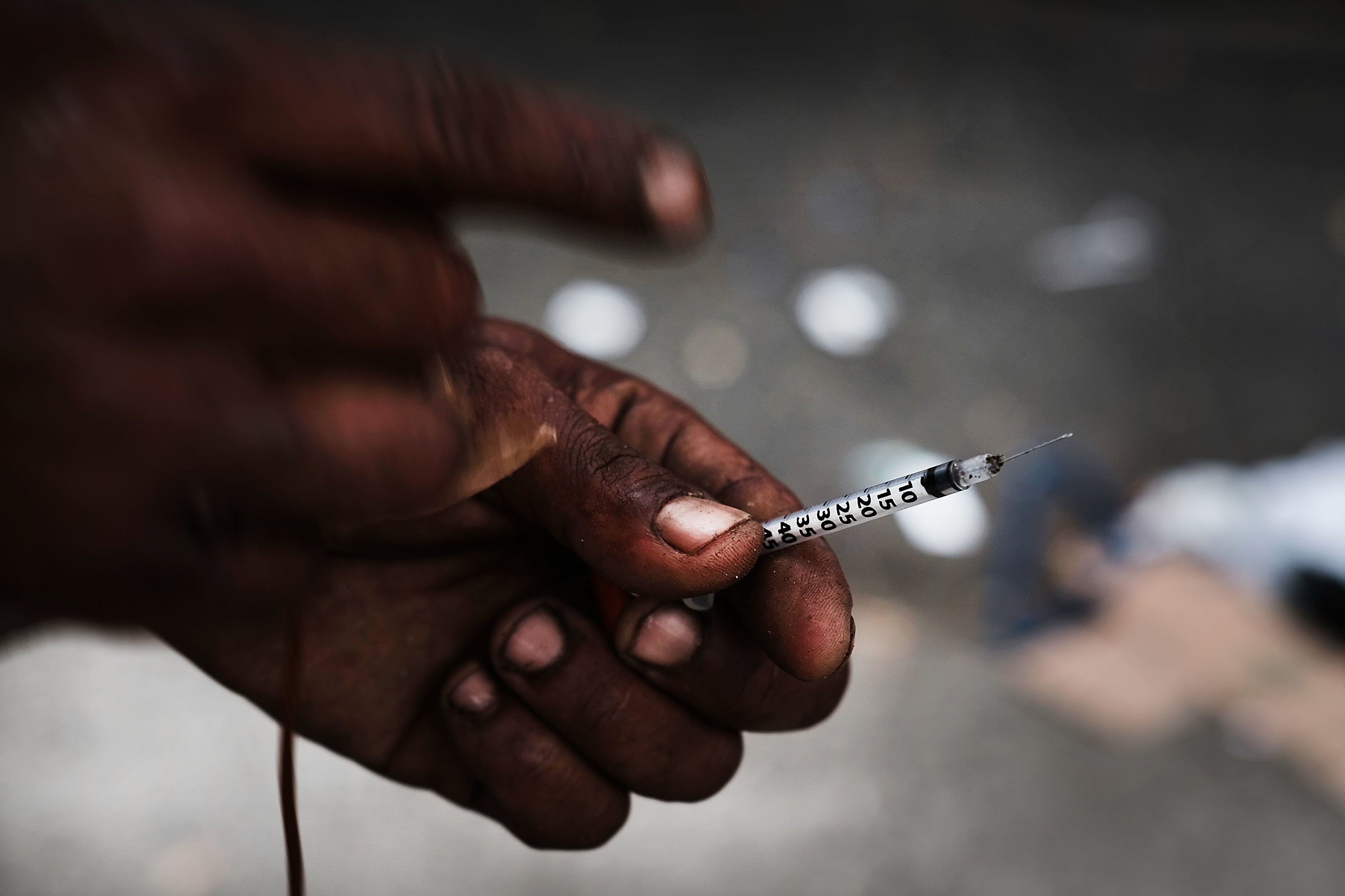 NEW YORK, NY - OCTOBER 06:  A heroin user displays a needle in a South Bronx neighborhood which has the highest rate of heroin-involved overdose deaths in the city on October 6, 2017 in New York City. Like Staten Island, parts of the Bronx are experiencing an epidemic in drug use, especially heroin and other opioid based drugs. More than 1,370 New Yorkers died from overdoses in 2016, the majority of those deaths involved opioids. According to the Deputy Attorney General, drug overdoses are now the leading cause of death for Americans under the age of 50.  (Photo by Spencer Platt/Getty Images)