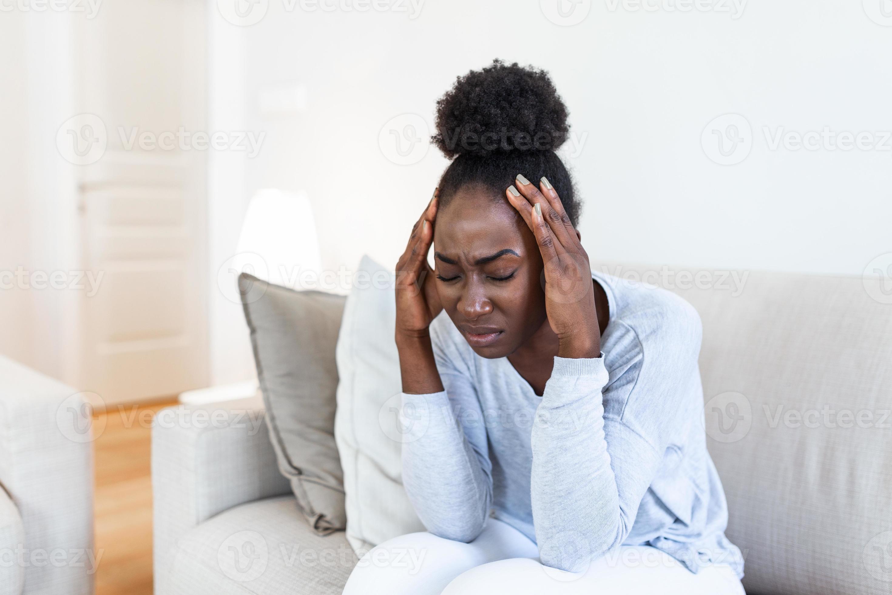 health-and-pain-stressed-exhausted-young-black-woman-having-strong-tension-headache-closeup-portrait-of-beautiful-sick-girl-suffering-from-head-migraine-feeling-pressure-and-stress-photo